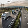 Caravan or convoy of trucks in line on a country highway