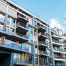 modern apartments with balconys and blue sky