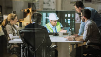 Architects and project manager in a video conference meeting with engineer 